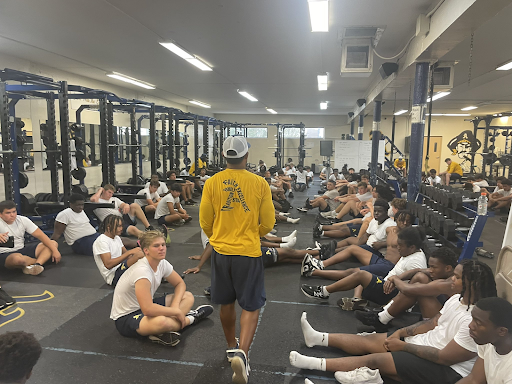 “Coach Harriot getting the team ready for the season”

Photo found via school Twitter account
With courtesy of Aquinas Football