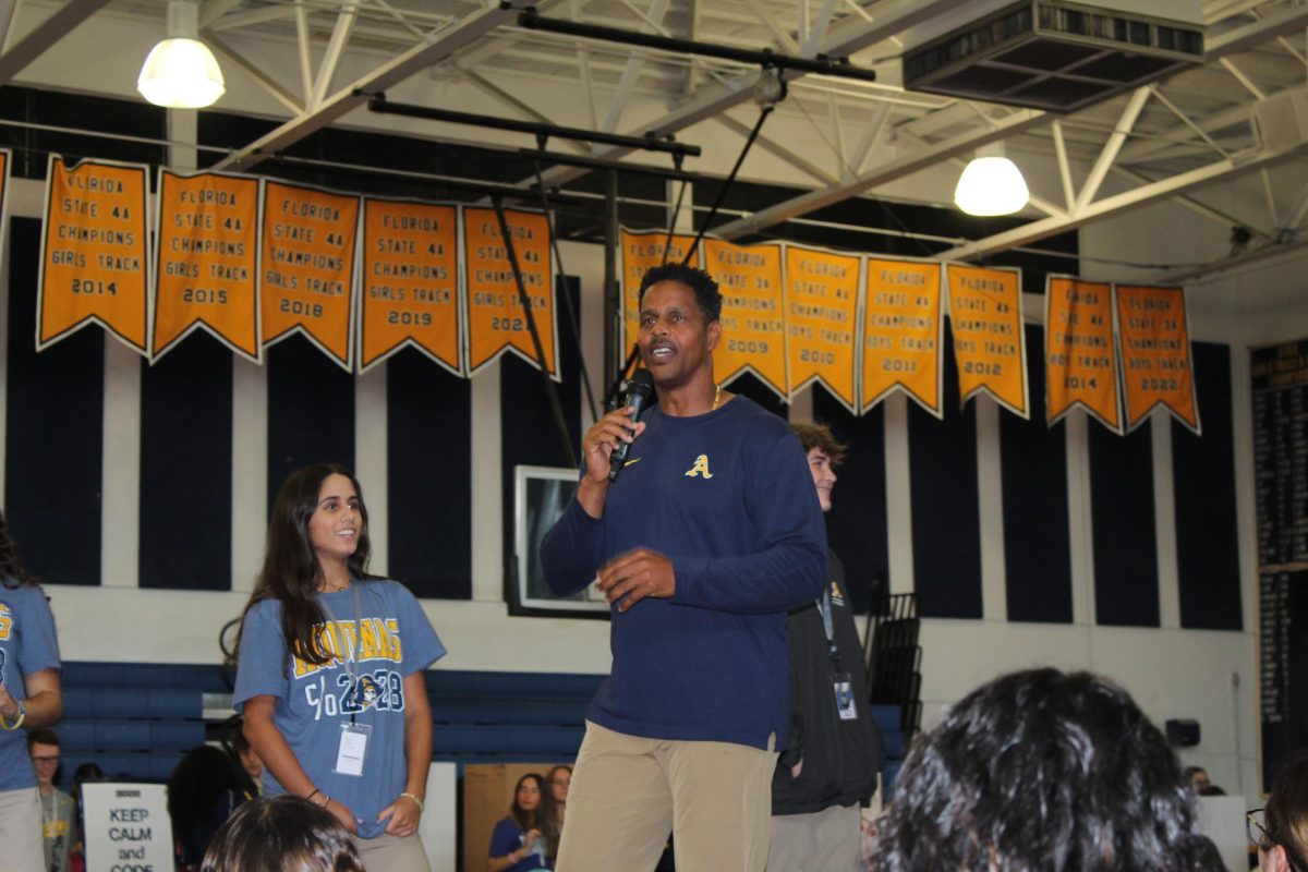 Coach Russell talking to freshmen students.