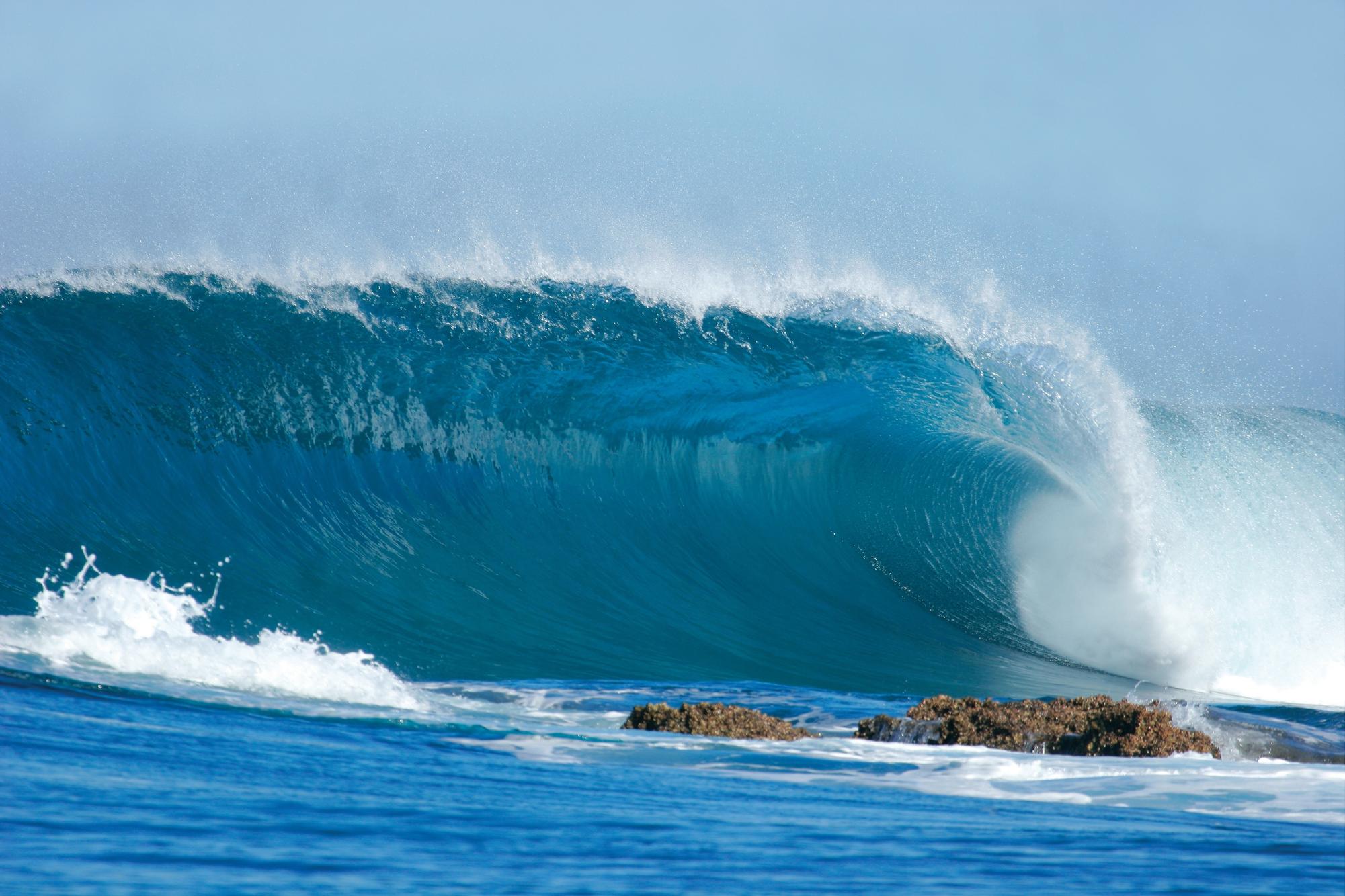 A wave breaks down a sandy point in rural Mozambique.
Photo by: RovingPhotogZA 
(Curtsey of Shutterstock)