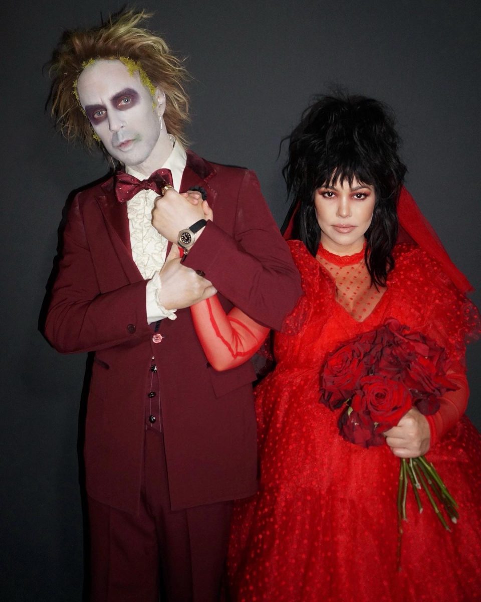 Kourtney Kardashian and Travis Barker dressed as characters from "Beetlejuice."