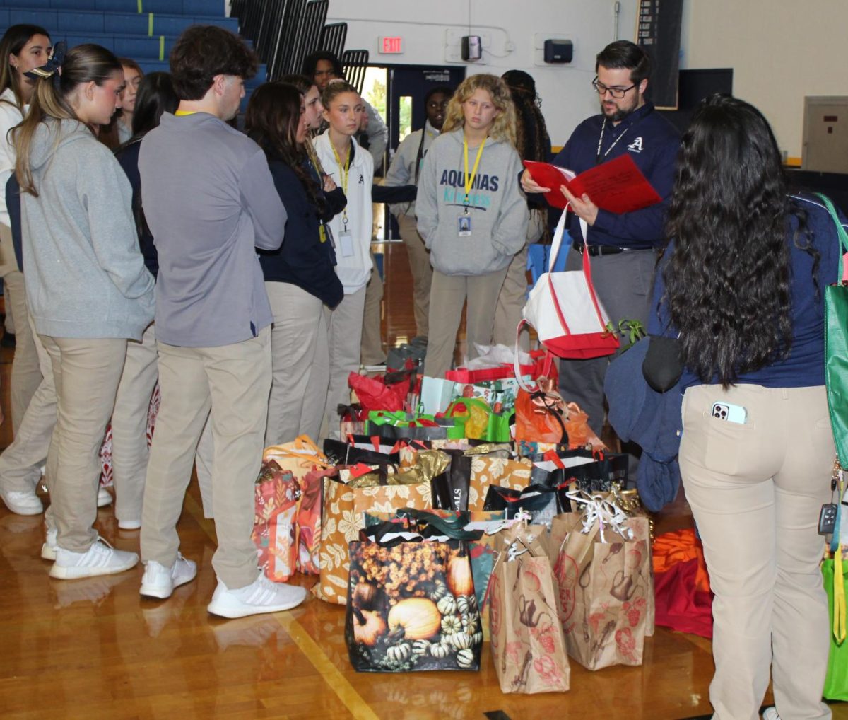 Seniors gather as their Thanksgiving offerings are blessed.