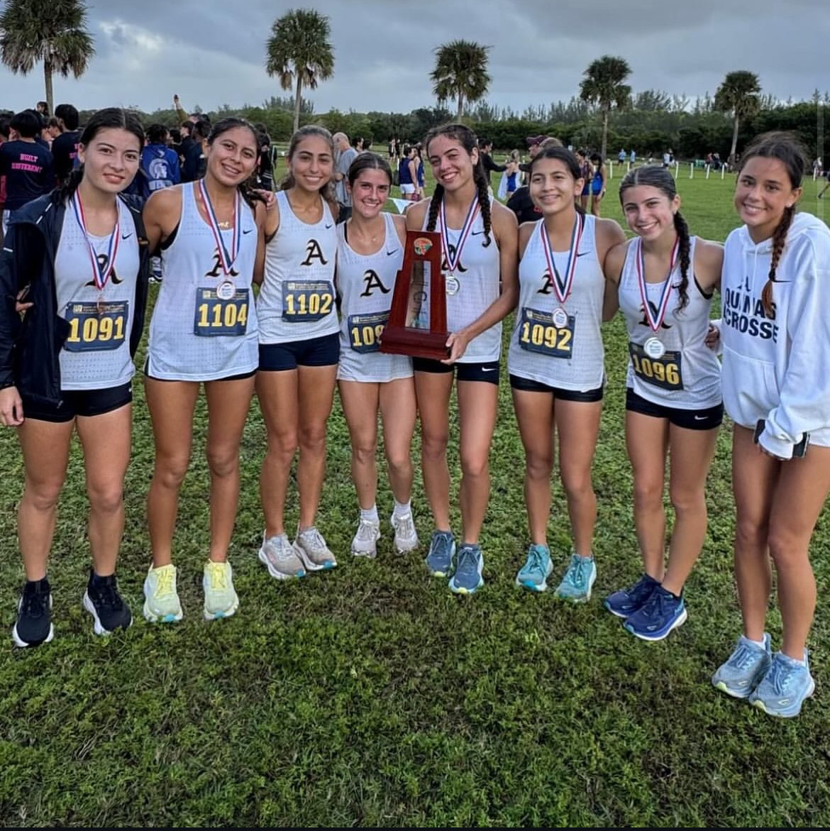 STA Girls' Cross Country showing off their hard-earned trophy!