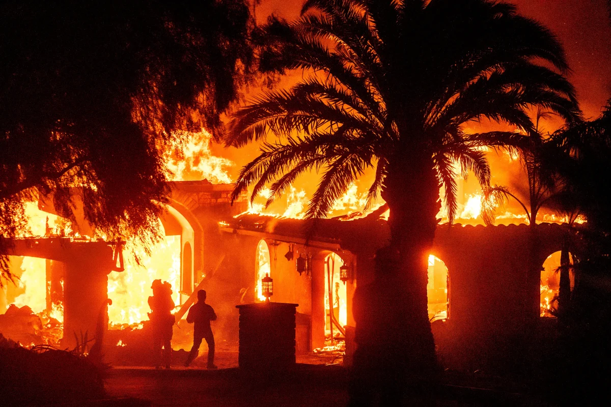 An LA resident evacuating his fire-engulfed home. Photo permission from KTLA Los Angeles News.