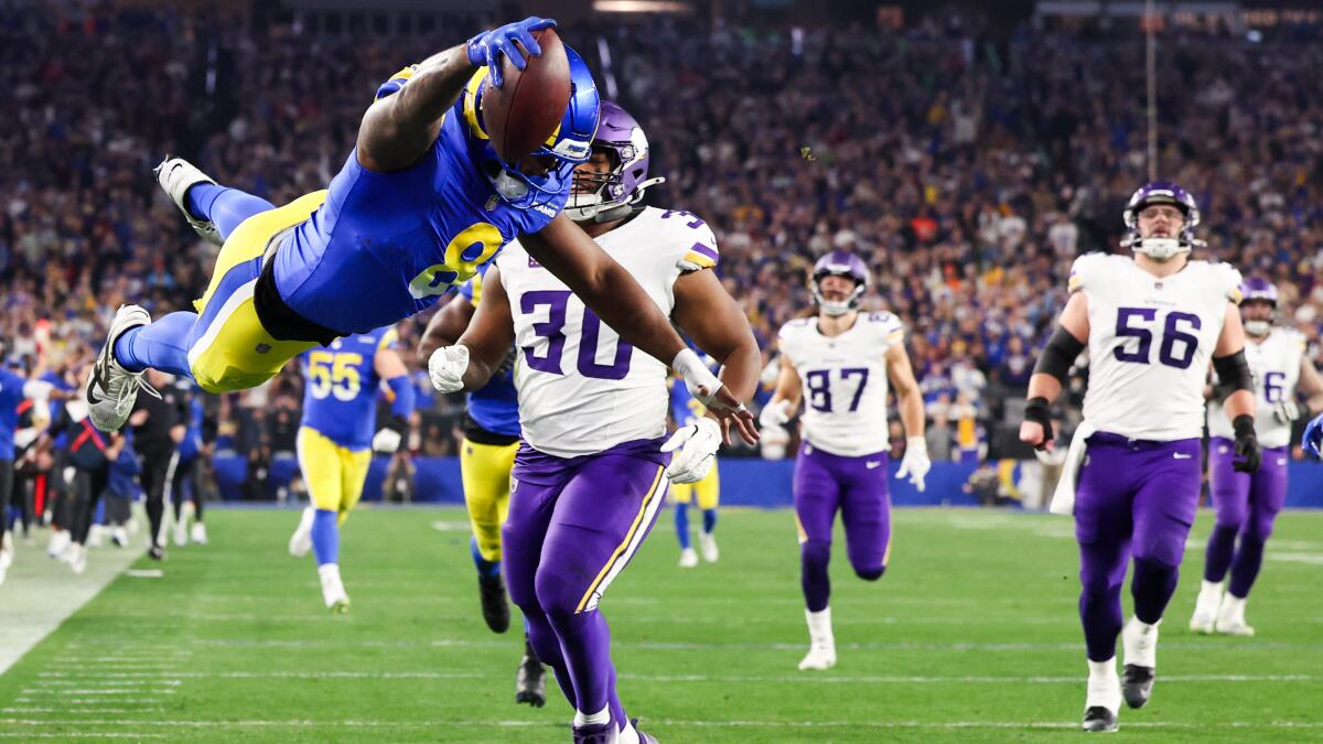 GLENDALE, AZ - JANUARY 13: Los Angeles Rams linebacker Jared Verse dives into the end zone ahead of Minnesota Vikings fullback C.J. Ham after cornerback Ahkello Witherspoon forces a fumble by quarterback Sam Darnold during the second quarter of the NFC Wildcard game at State Farm Stadium on Monday, Jan. 13, 2025 in Glendale, AZ. (Wally Skalij / Los Angeles Times)