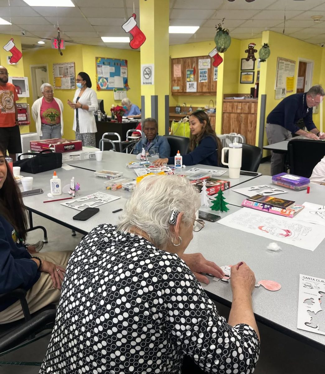 STA students assisted senior citizens in an arts and craft project during their visit to Cross Catholic Charities.