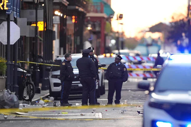 Emergency services at the scene on Bourbon Street in New Orleans after a vehicle drove into a crowd on Jan. 1, 2025, killing at least 14 people.