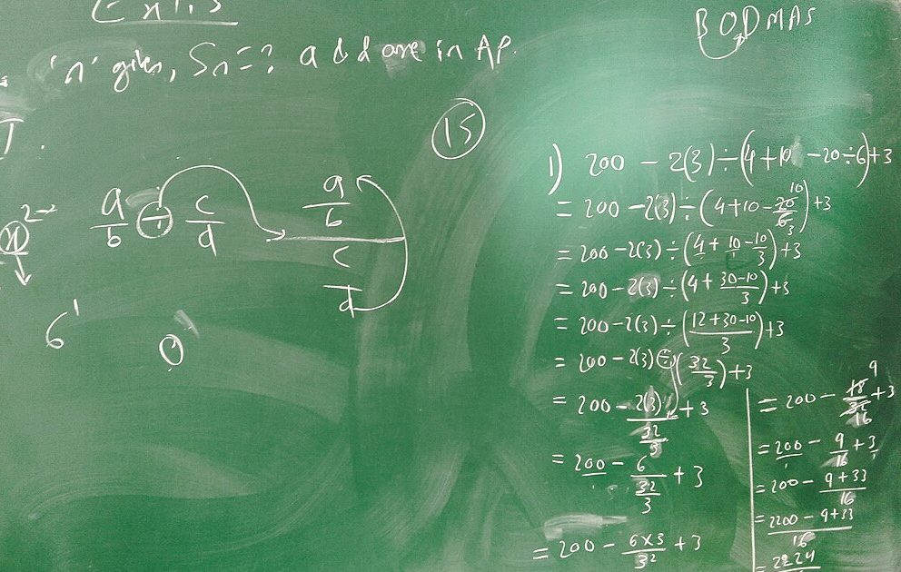 A chalkboard with math equations. Tnadafwork, CC0, via Wikimedia Commons