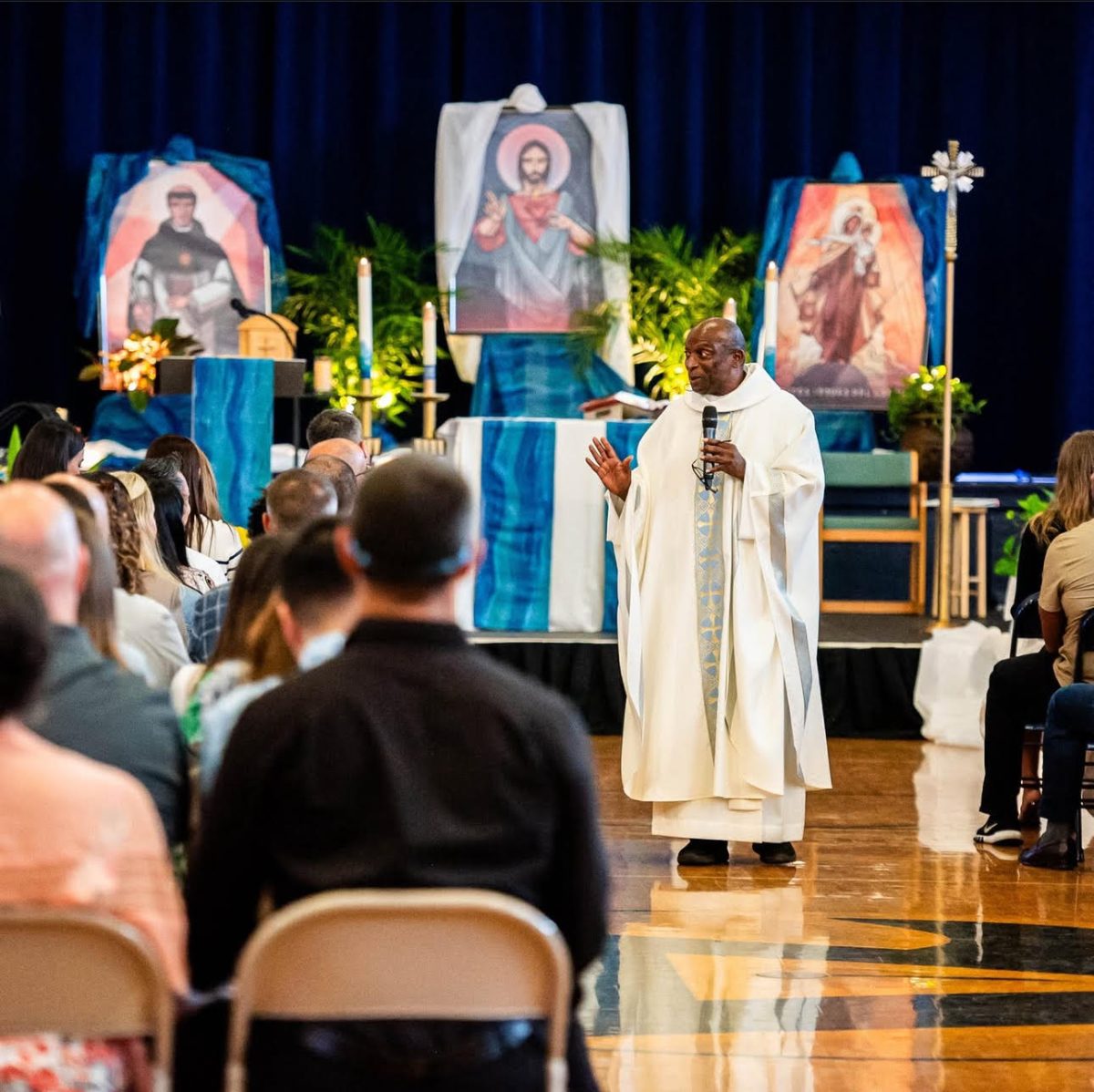 Father Celsus giving the Homily.