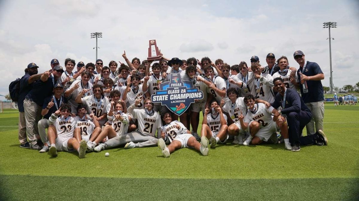 The 2025 varsity lacrosse team celebrates winning the state championship.