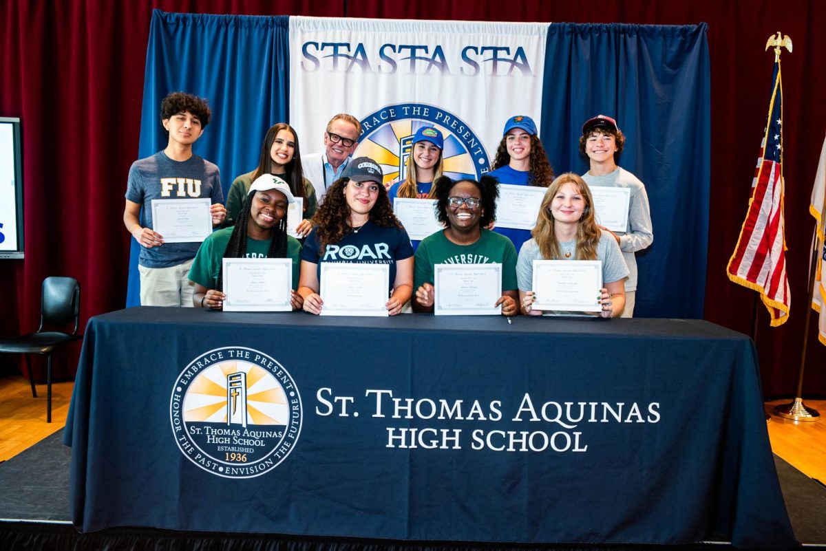 Proud moments at St. Thomas Aquinas High School as our talented seniors, officially commit to their next chapter in college for fine arts. With creativity, passion, and dedication they are ready to shape the future of art and culture. Dr. Muldar stands next to the bold visionary students: Madeline Sadowski, Alexi Arocho, Mirlissa Fenelus, Owen Ortiz, Gabriel Sedas, Laura Aluka, Grace Finneran, and Isabella Peralta.