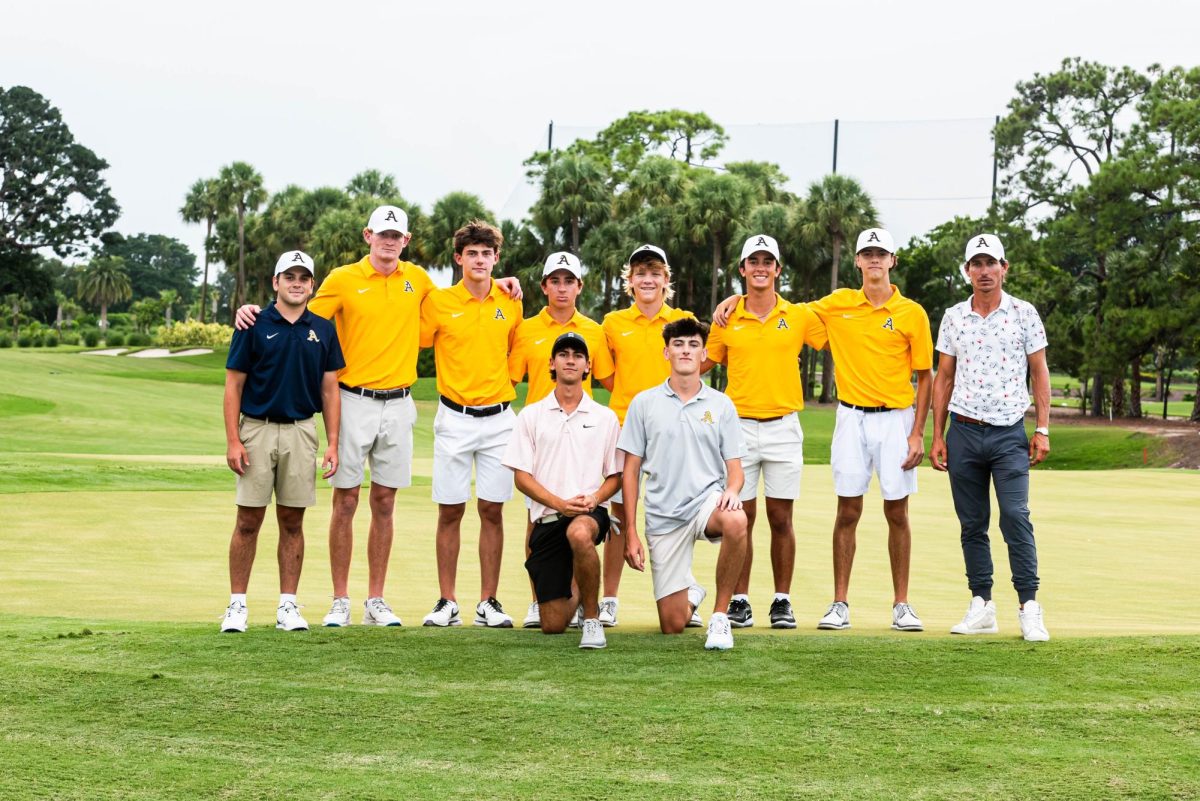 Team photo of St. Thomas Aquinas boys varsity golf team. Players from left to right: Nate Combs (12th), Austin Biasucci (12th), Joey Gilden (12th), Braden Chamberlain (9th), KC Cronin (10th), Joe Hendren (12th), Deven Onore (12th), Garret McDonald (12th)