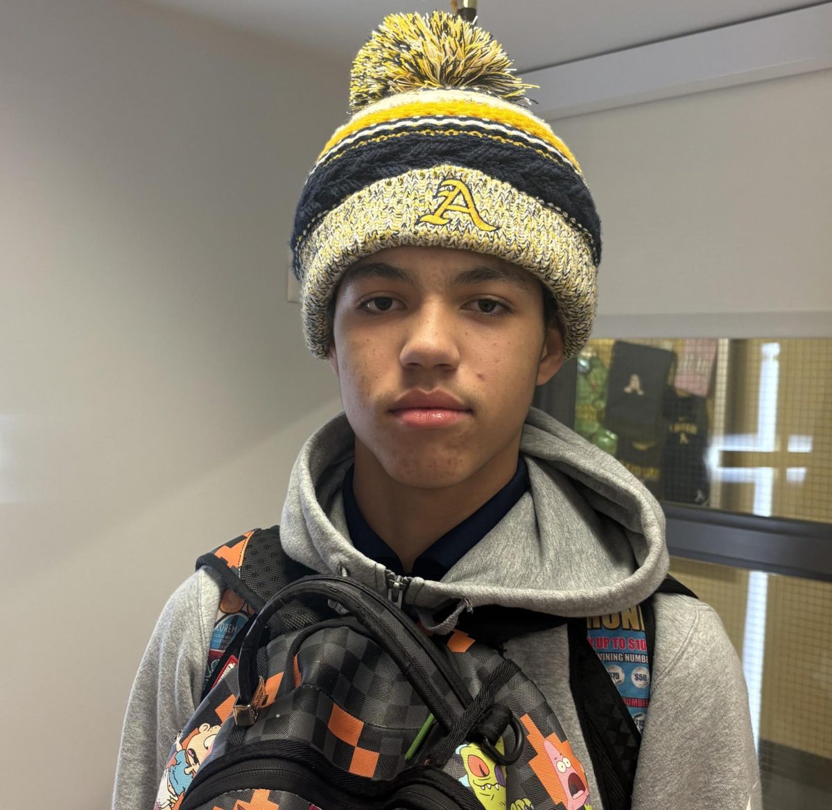 Freshman, Caden Talus borrowed a hat from a friend to stay warm.