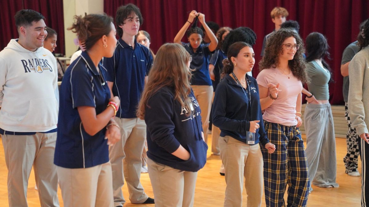 The cast of Footloose rehearses the title song in the dance studio.