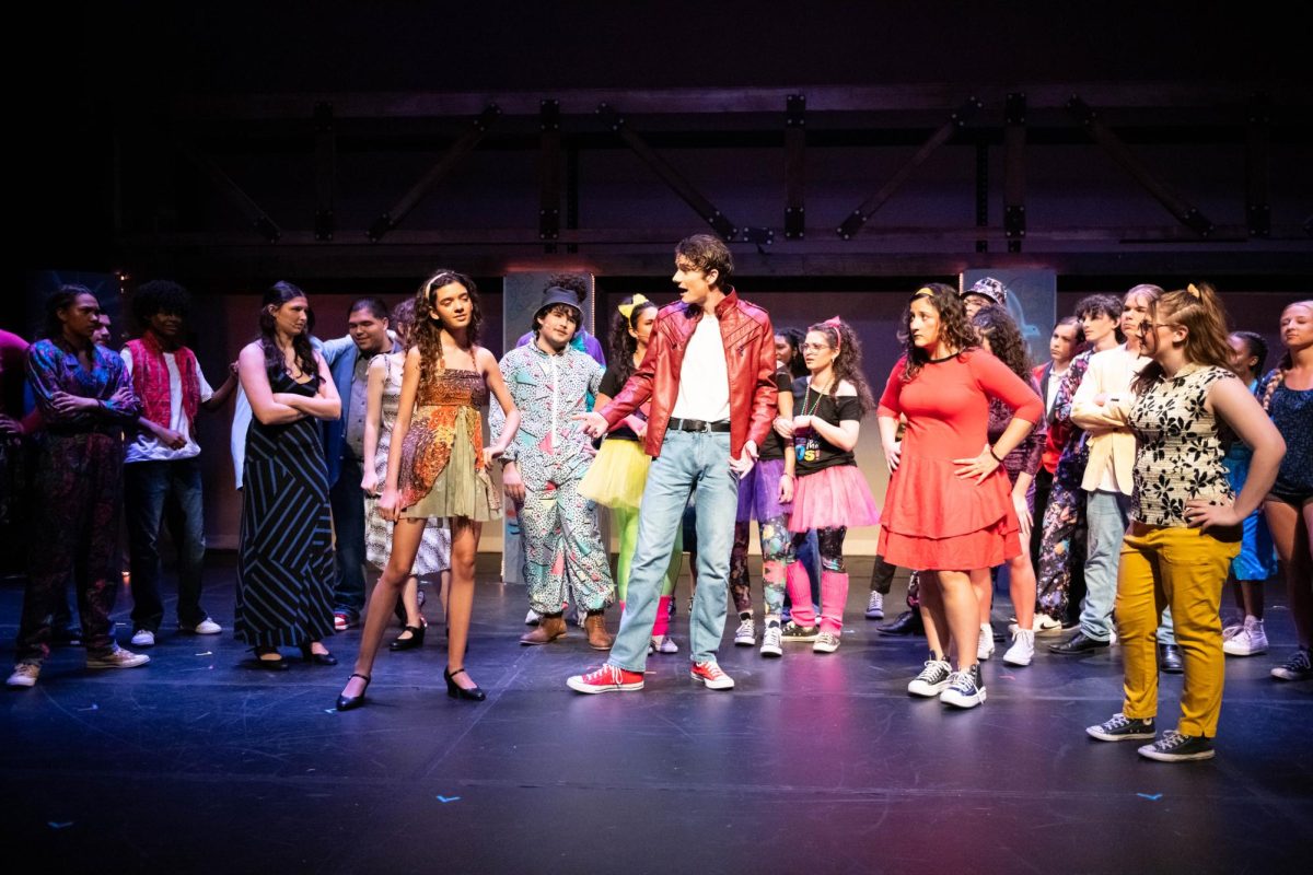 "Hey Ren, I heard you're leaving Chicago?" chants the ensemble to the lead character, Ren McCormack, played by Ethan Schaefer.