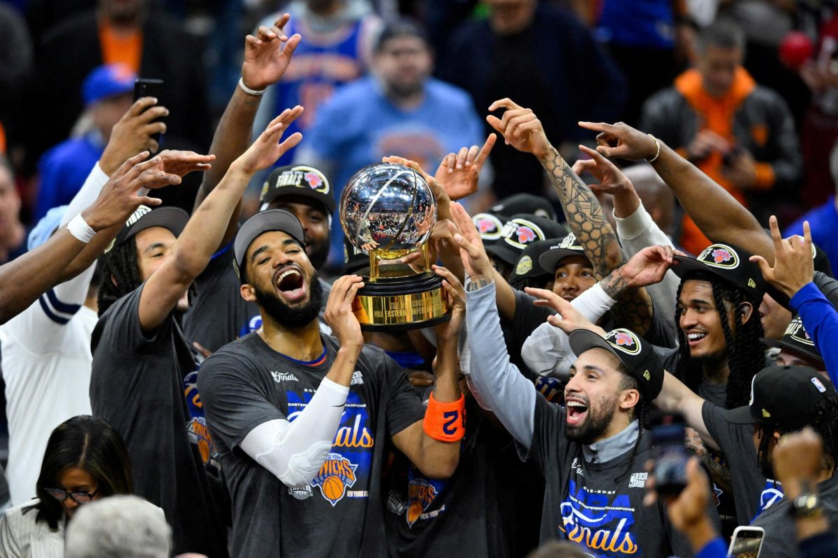 May 25, 2026; Cleveland, Ohio, USA; New York Knicks center Karl-Anthony Towns (32) lifts the 2026 Eastern Conference trophy with teammates after defeating the Cleveland Cavaliers in game four of the eastern conference finals for the 2026 NBA playoffs at Rocket Arena. Mandatory Credit: David Richard-Imagn Images     TPX IMAGES OF THE DAY