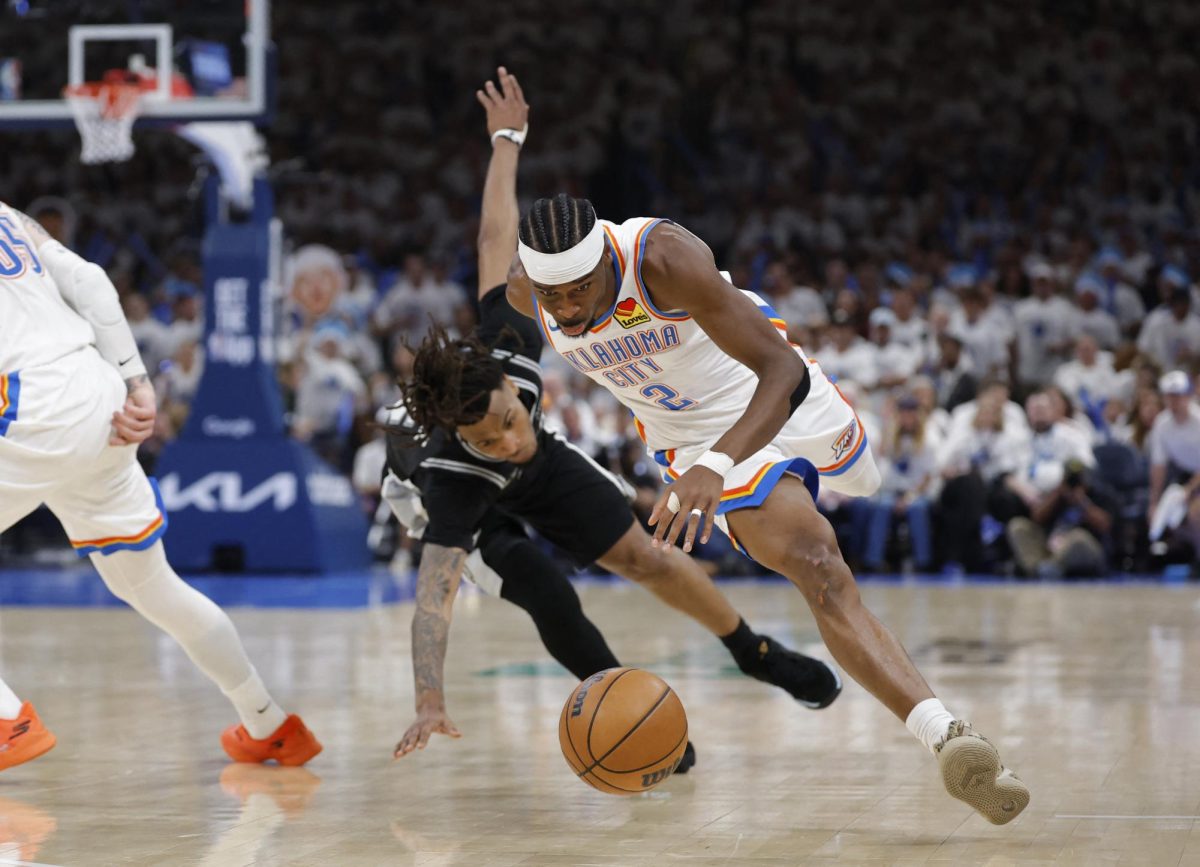 May 26, 2026; Oklahoma City, Oklahoma, USA; Oklahoma City Thunder guard Shai Gilgeous-Alexander (2) dribbles against San Antonio Spurs guard Stephon Castle (5) during the third quarter in game five of the western conference finals for the 2026 NBA playoffs at Paycom Center. Mandatory Credit: Alonzo Adams-Imagn Images